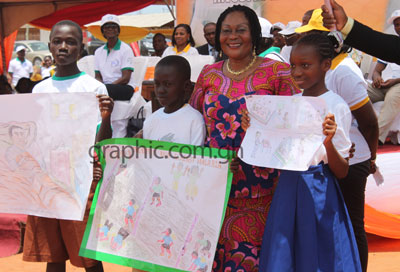 Mrs Lordina Mahama with winners of teh School Malaria Art Competition during the World Malaria Day celebration in Accra