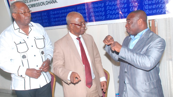 Mr Joseph Frimpong (right), Senior Inspector, Minerals Commission of Ghana, interacting with Mr Wilson Atta Krofah, Managing Director, WILEB Mining Supplies Limited,after a workshop held in Accra. With them is Mr Ebenezer Badoo (left), Operations Director of the company. 