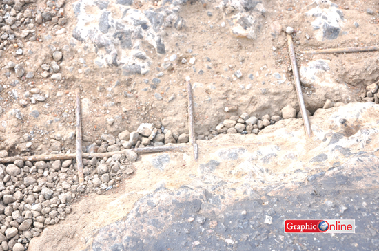 • Exposed iron rods on the road; a danger to drivers.