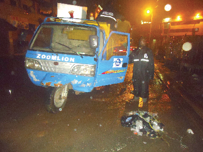 Sanitation worker clearing refuse in the city centre at night. Picture: KWAME ASARE BOADU