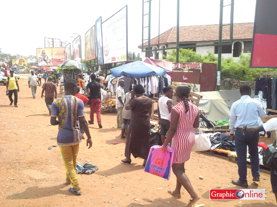 • Traders and customers at the unauthorised mall before the ejection.