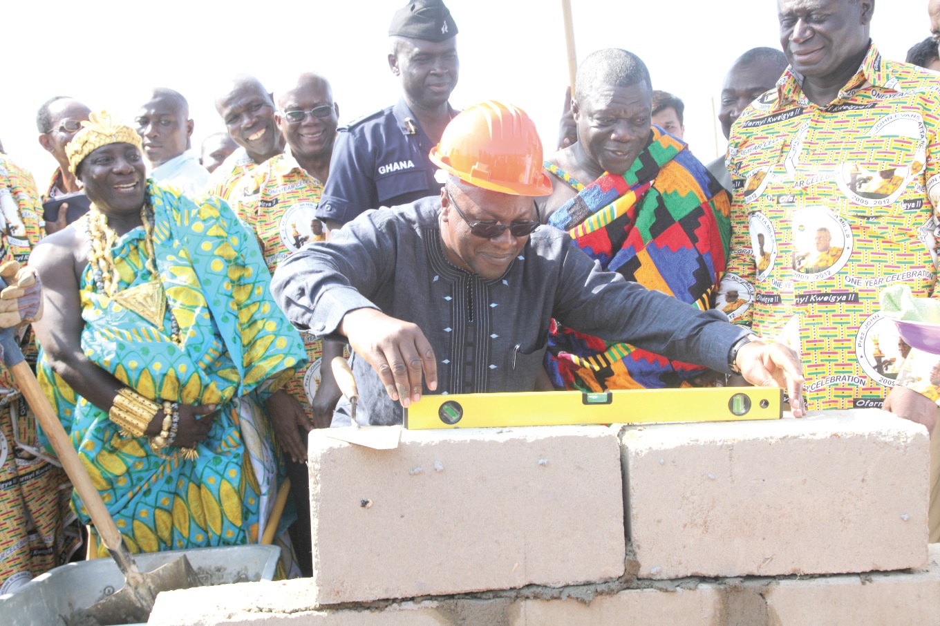 President Mahama laying blocks to mark the commencement of the construction of a fish processing plant at Elmina