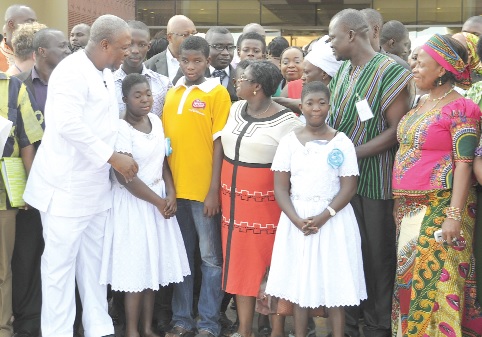 President Mahama interacting with the marginalised groups after the meeting at the Flagstaff House in Accra. Among them are some ministers of state.