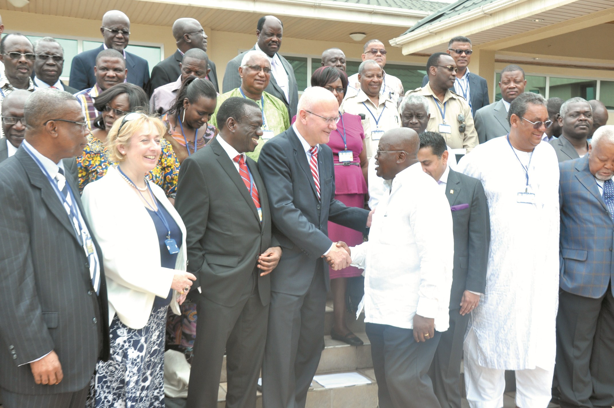  Nana Addo Dankwa Akufo-Addo shaking hands with Mr Eirik Moen, Secretary General of International Democratic Union (IDU). Those with them on the front row include Mr Peter Mac Manu (left), a former National Chairman of the NPP, Mrs Philipa Broom (2nd left), International Secretary of Conservation Party and Dr Kizza Besigye (3rd left), DUA Chairman.