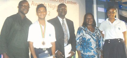 Left to right: Mr Benjamin Boakye-Dankwa, Vice Principal - Secondary, Sourav  Pattnaik, the star Award winner, Mr Emmanuel Arthur, winner of a teacher's award, Mrs Mabel Owusu-Addo, Principal, and Emmanuela Wood, a Sixth- form student.