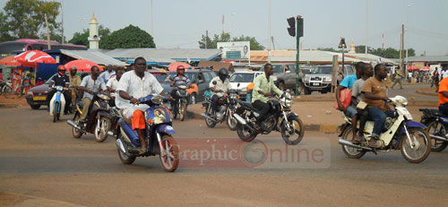 It is common to see commuters on motorbikes in the municipality of Tamale
