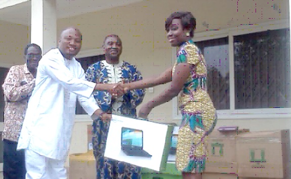 Mr Okudzeto-Ablakwa, a Deputy Minister of Education, receiving some items from Metropolitan Pensions Trust. To the extreme left is Mr Diop Frimpong, the CEO of Metropolitan Pensions Trust