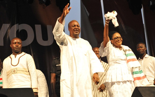 President John Mahama and wife Lordina acknowledge cheers from the teeming crowd