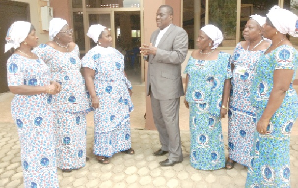 The Head Pastor of the Ho Fiave branch of the Global Evangelical Church, Rev. Samuel Sovor (middle), stressing a point on the need to ensure peace to the executive of the Ho Women’s Presbytery 