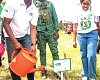 Dr Hugh C.A Brown (left), Chief Executive of the Forestry Commission, planting a tree to mark World Environment Day