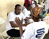 A beneficiary undergoing health screening