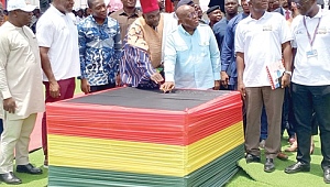 President Akufo-Addo (2nd from right) pressing the knob to commission the solar plant