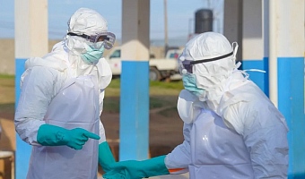 Medical staff must wear protective equipment when treating people with Ebola because it spread through bodily fluids