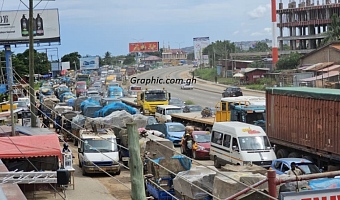Tricycles compete with vehicles from the Kasoa-Accra section at Mangoline. Pictures: DOUGLAS ANANE-FRIMPONG & ERNEST KODZI