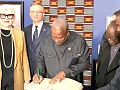 President John Mahama signing a visitors’ book after inspecting the exhibition