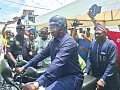 Joseph Bukari Nikpe, Minister of Transport, riding a motorcycle to symbolise the launch of the Safe Journey campaign by the NRSA