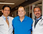 Patient Tim Andrews (centre) with Dr Tatsuo Kawai (left) and Dr Leonardo Riella (right)