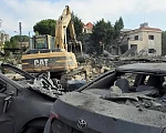 One of the overnight strikes in Kfar Remman destroyed a three-storey residential building