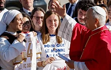 The pontiff greeted crowds waiting for him on the tarmac at Orly airport