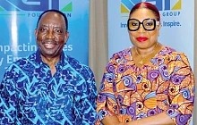 Alex Apau Dadey (left), Chairman, KGL Group, with Helga Boadi, Executive Director, GNPC Foundation
