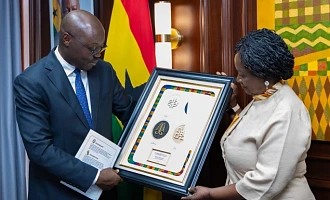 Vice-President Prof. Naana Jane Opoku-Agyemang (right), in a hearty interaction with Dr Cassiel Ato Forson, Minister of Finance, during the visit