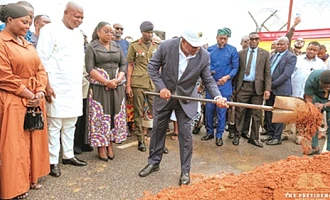 President John Dramani Mahama cutting the sod for the construction of a multi-purpose, multi-tiered car park and airport hotels complex at the Accra International Airport. Looking on are Joseph Bukari Nikpe (2nd from left), Minister of Transport; Yvonne Nana Afriyie Opare (3rd from left),  Managing Director of the Ghana Airports Company Limited, and other dignitaries