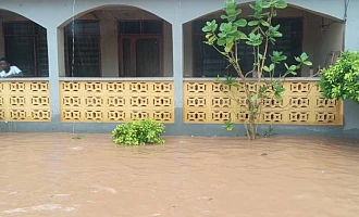 Emmanuel Kwesi Dawood Mensah (right), Central Regional NADMO Director, and other NADMO officials  visiting Ekon, an affected surburb in Cape Coast