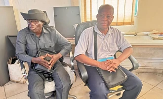 Mr Justice Kojo Tsekpo (right), leader and spokesperson for the Concerned Citizens of Maamobi No. 2 Market, with Mr Emmanuel, during an interview with  Graphic Online