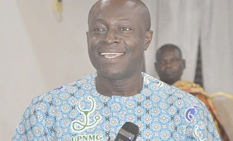 Maxwell Oduro Yeboah (right), National President of the Union of Professional Nurses and Midwives, addressing the conference