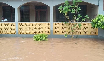Emmanuel Kwesi Dawood Mensah (right), Central Regional NADMO Director, and other NADMO officials  visiting Ekon, an affected surburb in Cape Coast