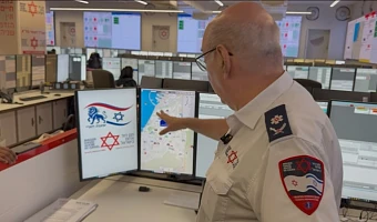 Chaim Rafalowski, Coordinator of International Cooperation at Magen David Adom, explaining how the ambulance service works in Israel