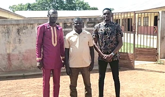 Samuel Donkor (middle) with the two newly posted teachers, Simon Uwumborlayi (left) and Jagri Thomas Ntesan (right), pose in front of the school