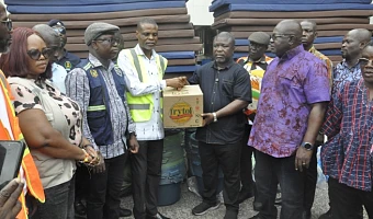 James Gunu (third, right), Volta Regional Minister, receiving the items from Paschal Agbagba, Volta Regional Director of NADMO while some DCEs look on