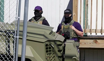 US Immigration and Customs Enforcement (ICE) agents stand guard in Newark, NJ, US [File: Jeenah Moon/Reuters]