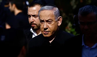 Israeli Prime Minister Benjamin Netanyahu attends the funeral of Gal Meir Eisenkot, 25, an Israeli solider and the son of Israeli cabinet minister and former military chief Gadi Eisenkot, who was killed in northern Gaza during the ongoing ground operation by Israel's military in the Gaza Strip, in Herzliya, Israel, December 8, 2023. REUTERS/Clodagh Kilcoyne