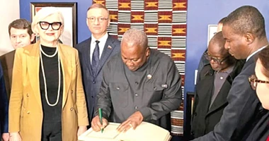 President John Mahama signing a visitors’ book after inspecting the exhibition