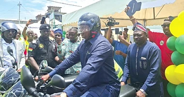 Joseph Bukari Nikpe, Minister of Transport, riding a motorcycle to symbolise the launch of the Safe Journey campaign by the NRSA