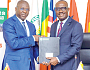  Dr Mohammed Amin Adam (left), Minister of Finance, exchanging documents with Dr George Agyekum Donkor, President and Chairman of the Board of Directors of EBID, after signing the MoU