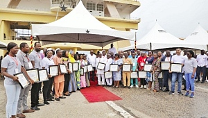  President Akufo-Addo (middle) with some workers who were honoured at the event. Picture: DOUGLAS ANANE-FRIMPONG