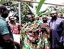 Barimah Effiriti Sampson-Siaw (in cloth), Mawerehene of the Dormaa Traditional Area, handing over one of the seedlings to a beneficiary farmer. Looking on is Emmanuel Kofi Agyemang (2nd from right), the Dormaa East DCE