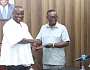  Andy Appiah Kubi (right), Chairman of the Devesting Committee and Member of Parliament for Asante-Akim North Constituency, presenting the report to Samuel Abu Jinapor (left), Minister of Lands and Natural Resources, after the meeting with the committee. Picture: ELVS NII NOI DOWUONA